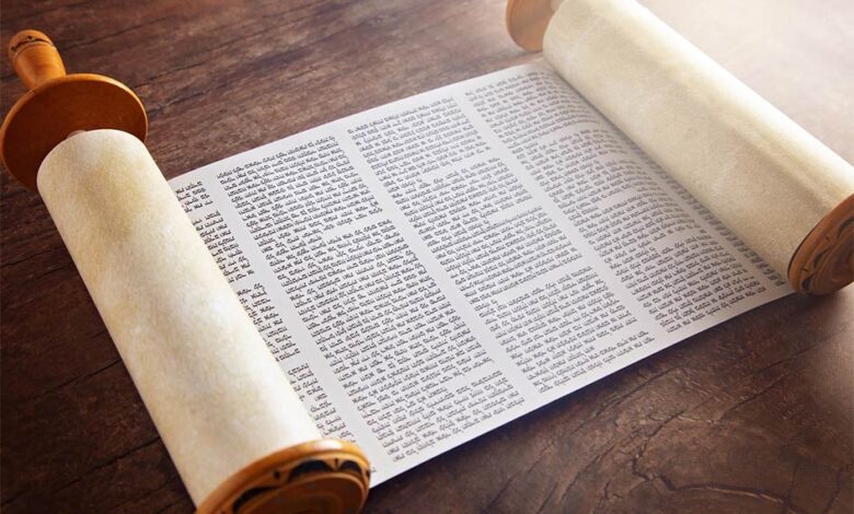 The Sefer Torah, or Toral scroll, is a handwritten copy of the Torah Pentateuch, used for ritual Torah readings, known as parashah. Source: pamela_d_mcadams / Adobe Stock