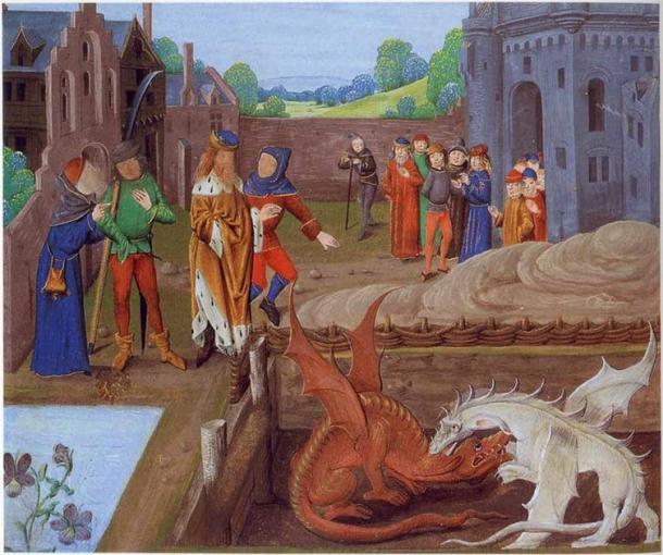 Sur la photo, Vortigern est assis au bord d'un bassin d'où émergent deux dragons, un rouge et un blanc, qui se battent en sa présence. Détail de la bibliothèque du palais de Lambeth MS 6 folio 43v illustrant un épisode de Historia Regum Britanniae (v. 1136). (Domaine public)