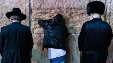Three different Jewish people giving Selichot prayers at the Wailing Wall, Jerusalem