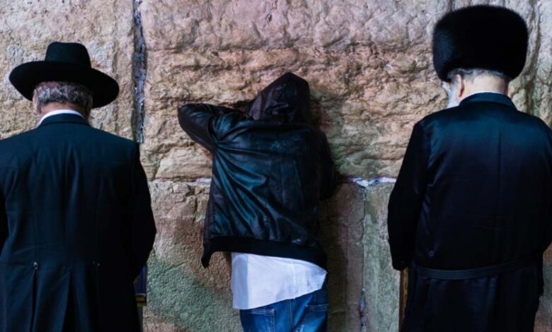 Three different Jewish people giving Selichot prayers at the Wailing Wall, Jerusalem