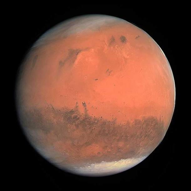 Image en couleurs de Mars prise par l'instrument OSIRIS à bord de la sonde spatiale Rosetta de l'ESA lors de son survol de la planète en février 2007. L'image a été générée en utilisant les filtres orange (rouge), vert et bleu d'OSIRIS. (ESA - Agence spatiale européenne & Institut Max-Planck pour la recherche sur le système solaire pour l'équipe OSIRIS/CC BY SA 3.0)