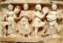 Hellenistic culture in the Indian subcontinent: Greek clothes, amphoras, win,e and music. Detail from Chakhil-i-Ghoundi Stupa, Hadda, Gandhara, 1st century AD.